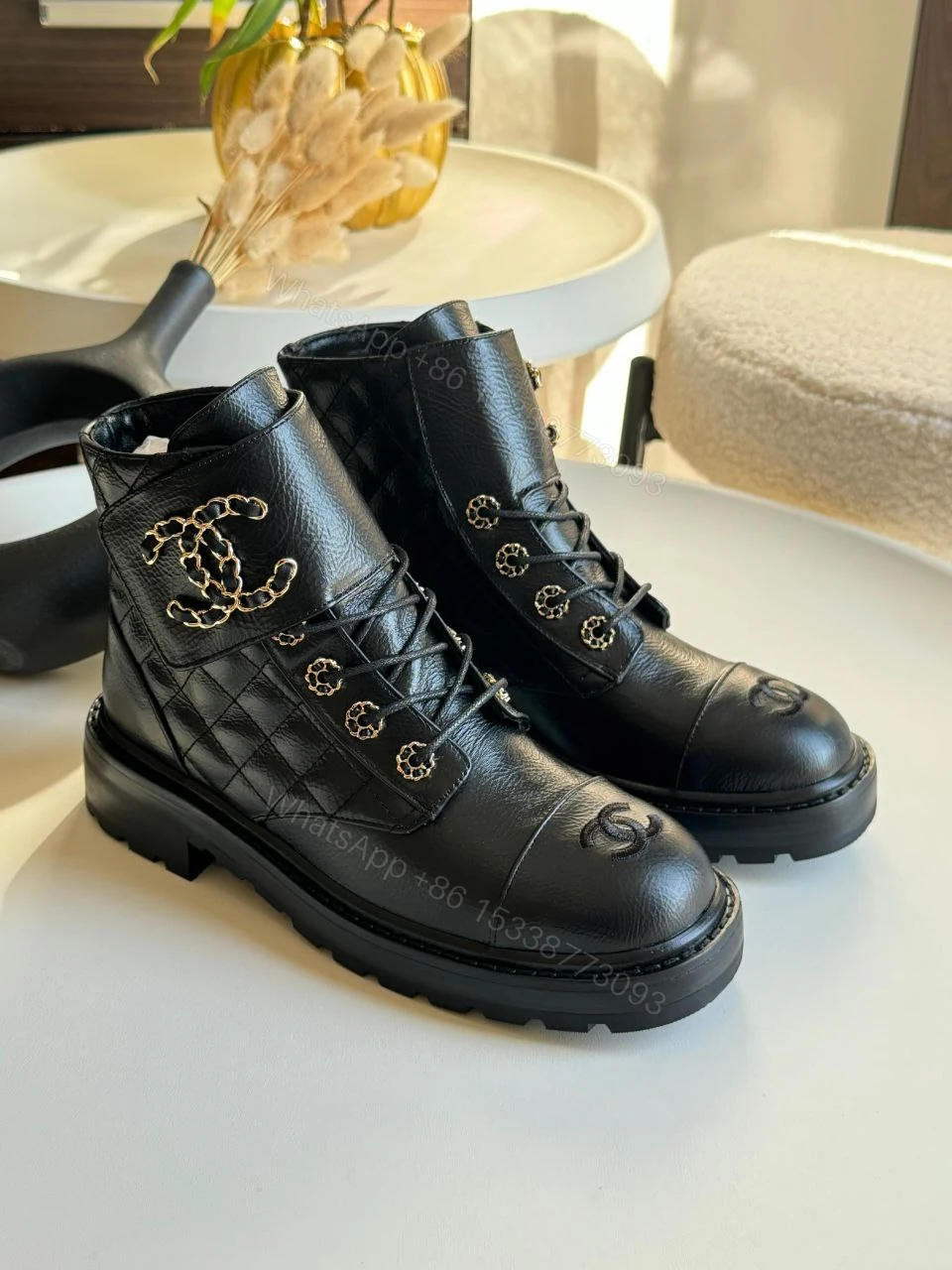 Chanel Black Quilted Leather CC Cap Toe Chain Link Logo Combat Boots — view 1