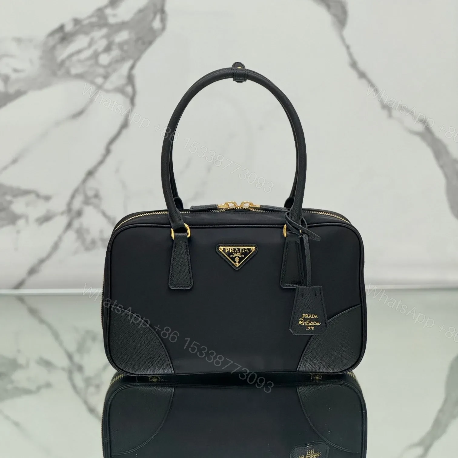 MEDIUM TOP HANDLE BAG 30 IN BLACK NYLON AND CALFSKIN TRIM — view 1