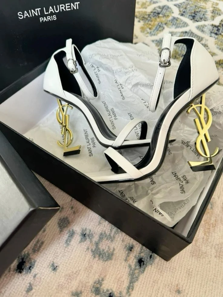 white and black heels are the Saint Laurent Opyum model — view 1