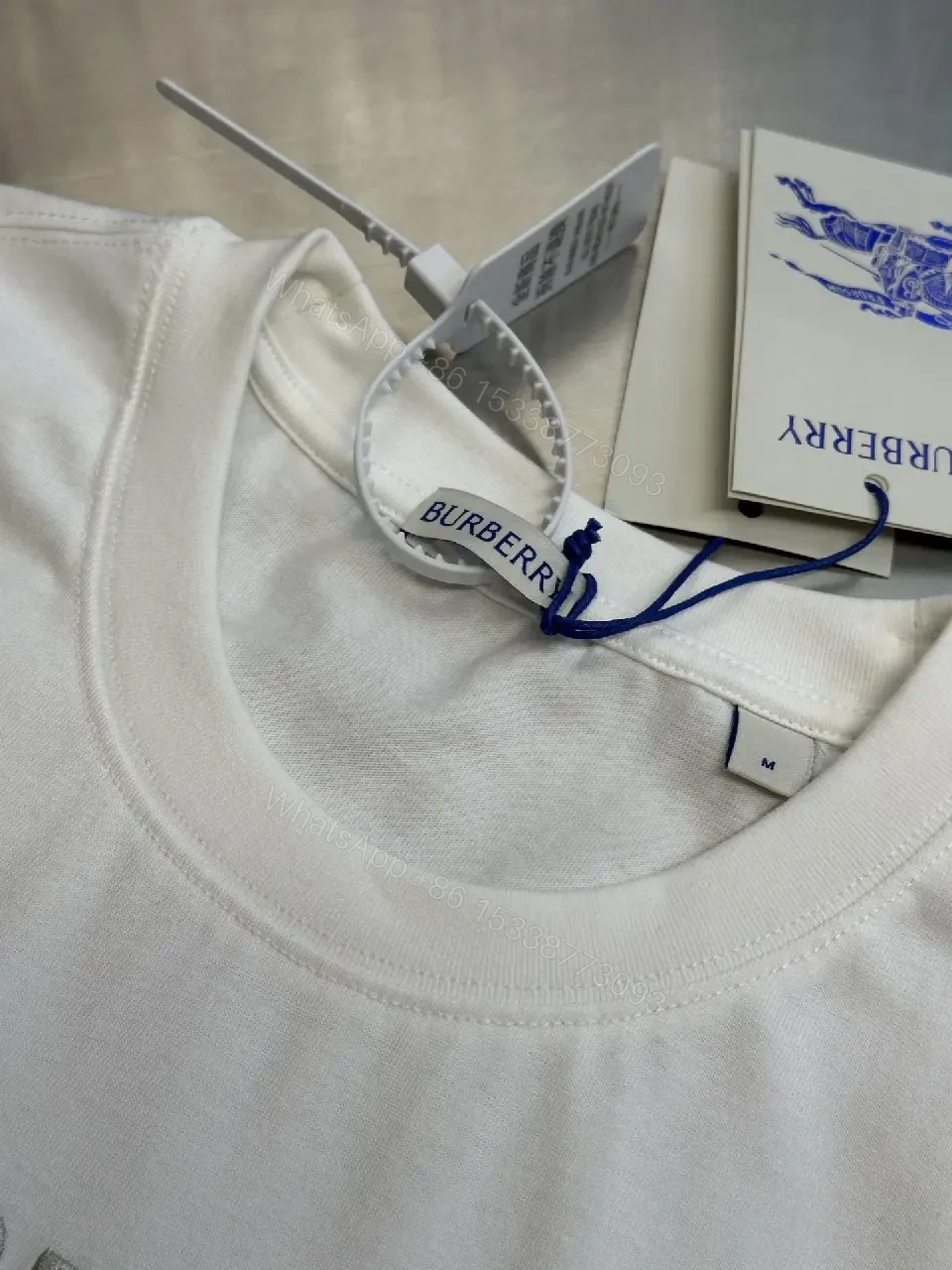 View 5 of Minimalist White Tee with Iconic Horse Motif, Premium Cotton