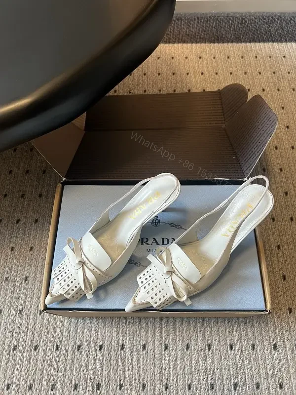 White Leather Slingback Heels with Studded Bow – Classic Prada Style — view 1