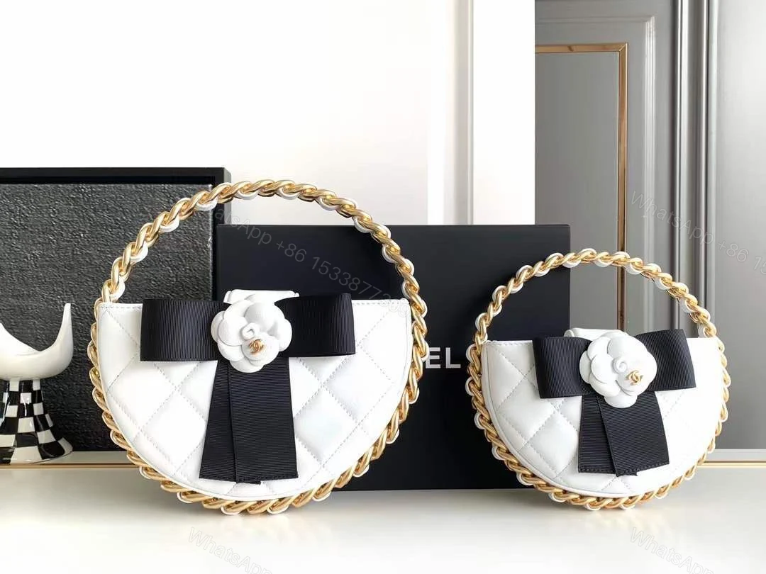 Chanel Quilted Leather Mini Round Camellia Clutch — view 1