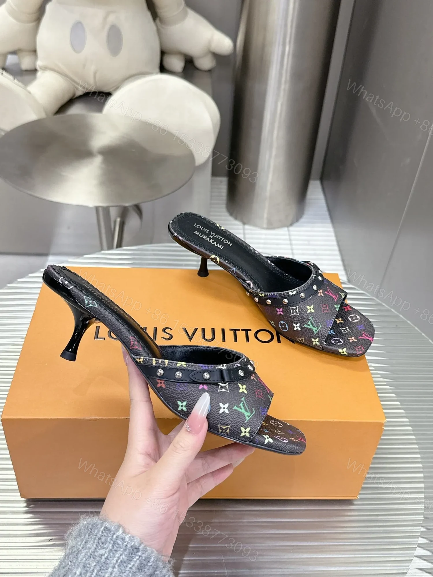 View 6 of LV Women Black Patterned Leather Mules