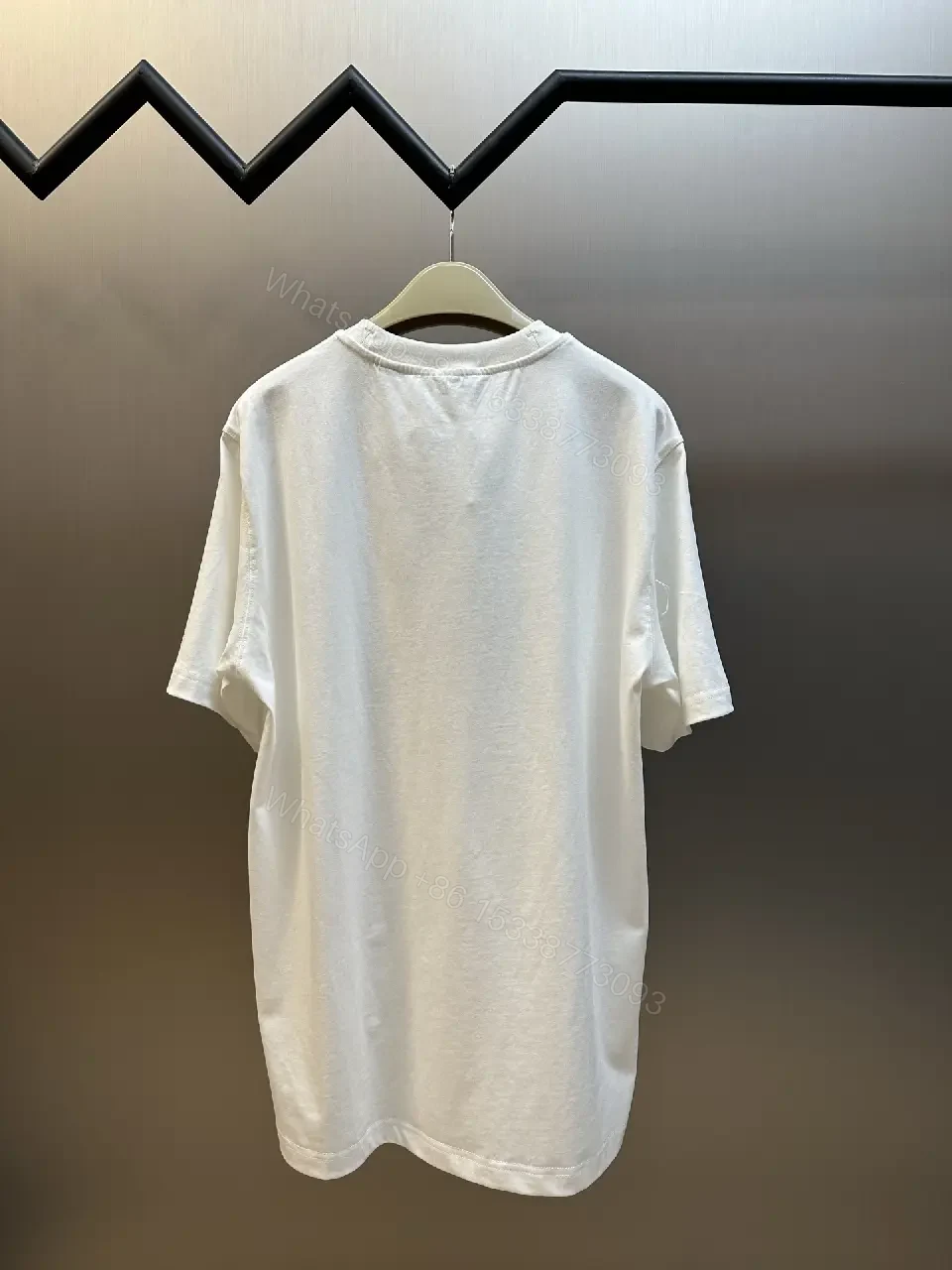 View 7 of Minimalist White Tee with Iconic Horse Motif, Premium Cotton