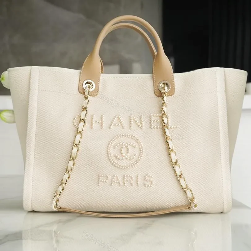CHANEL TOTE BAG 39 ATTACHED PEARL LOGO IN BEIGE CANVAS GOLD HARDWARE — view 1