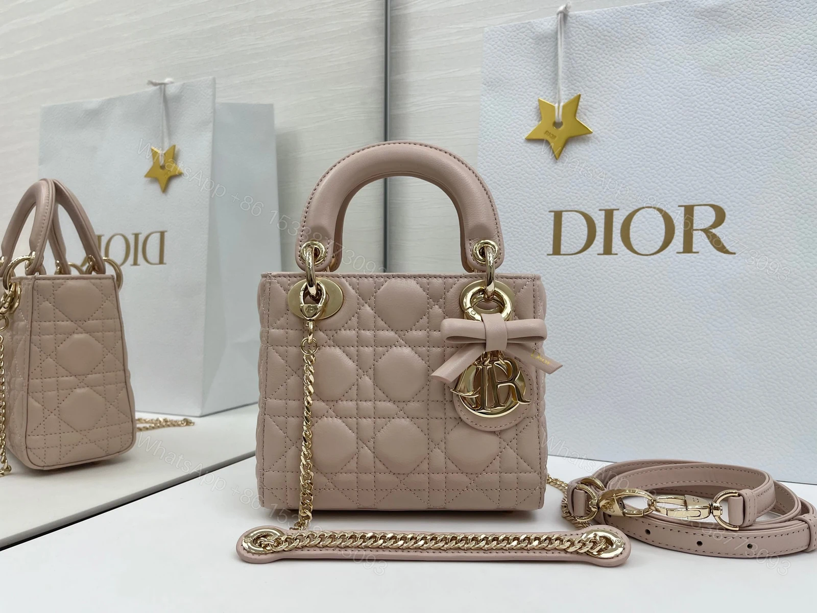 高仿Dior Lady D-Joy裸粉迷你包 小羊皮蝴蝶結金屬吊飾設計 — view 1