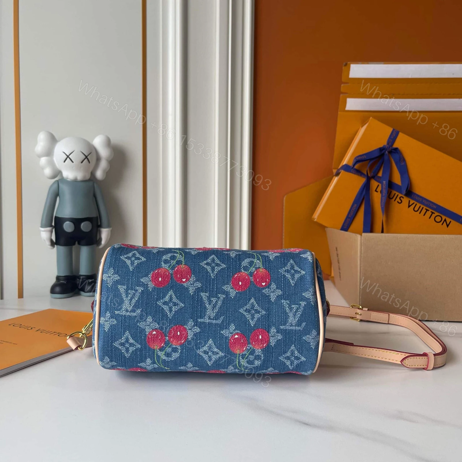 View 8 of LOUIS VUITTON X TAKASHI MURAKAMI SPEEDY BANDOULIÈRE 20 MONOGRAM DENIM BLUE 20CM