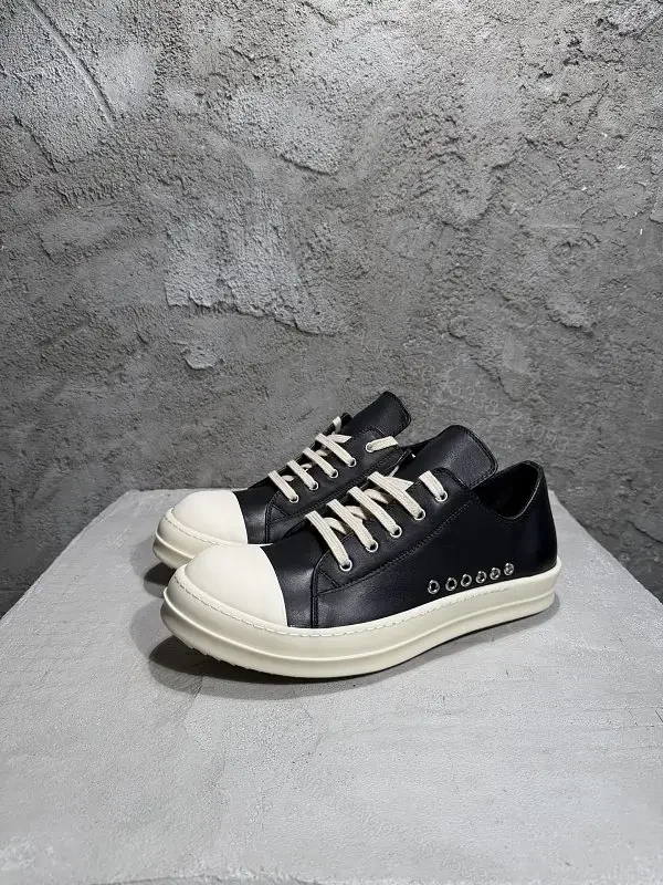 Black Leather Casual Sneakers with White Toe Cap and Stud Details — view 1