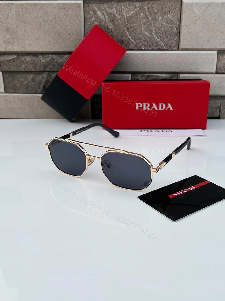 Prada Geometric Sunglasses Gold Frame Dark Grey Lenses — view 1