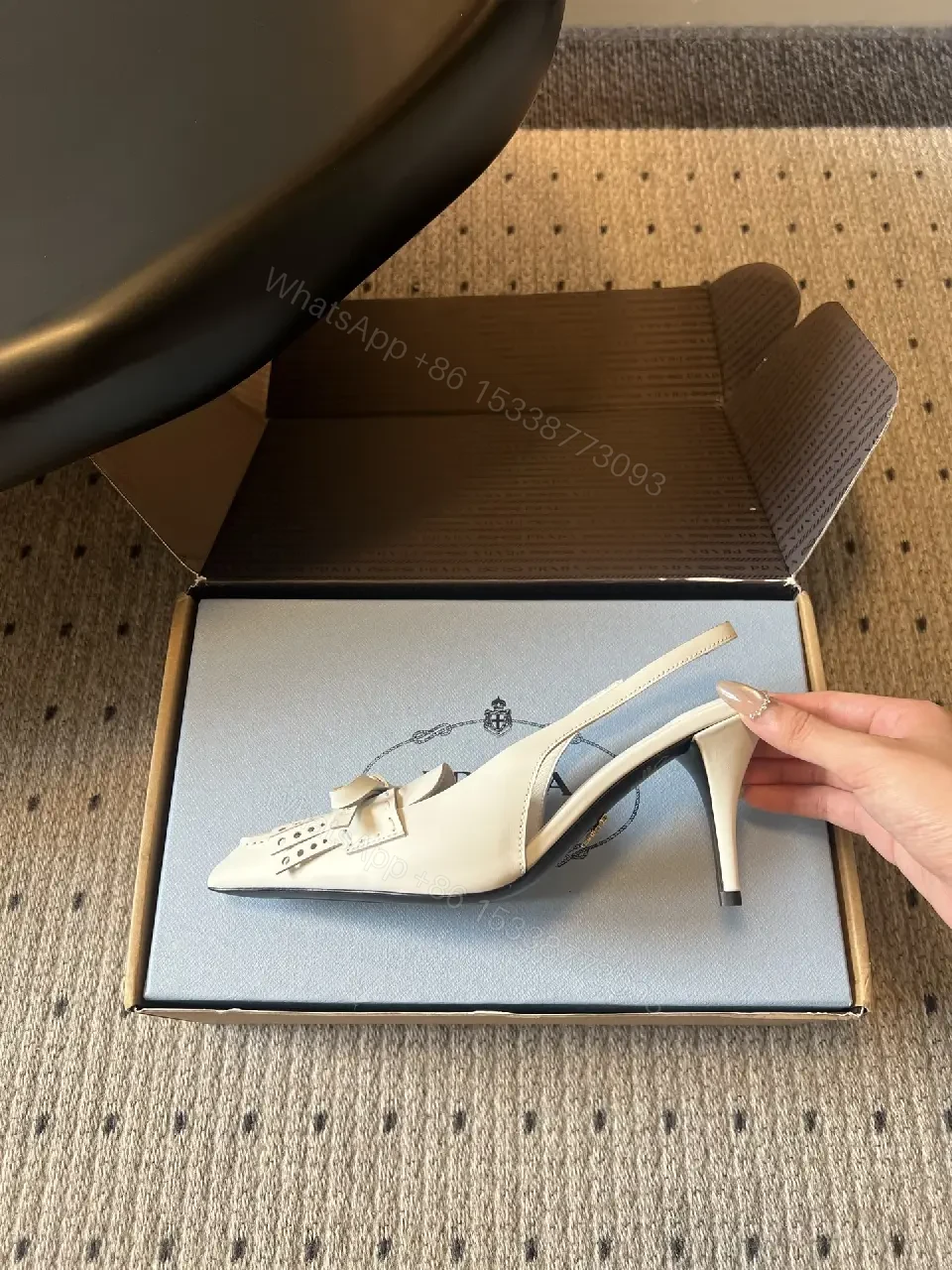 View 9 of White Leather Slingback Heels with Studded Bow – Classic Prada Style