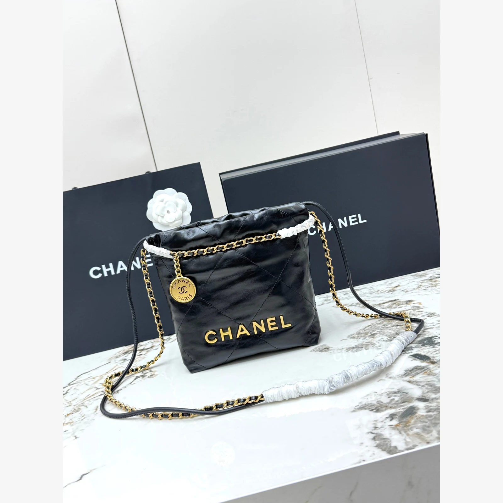 Chanel 22 Mini Handbag · Black Shiny Calfskin Black · Shiny Calfskin · Gold-Tone Metal