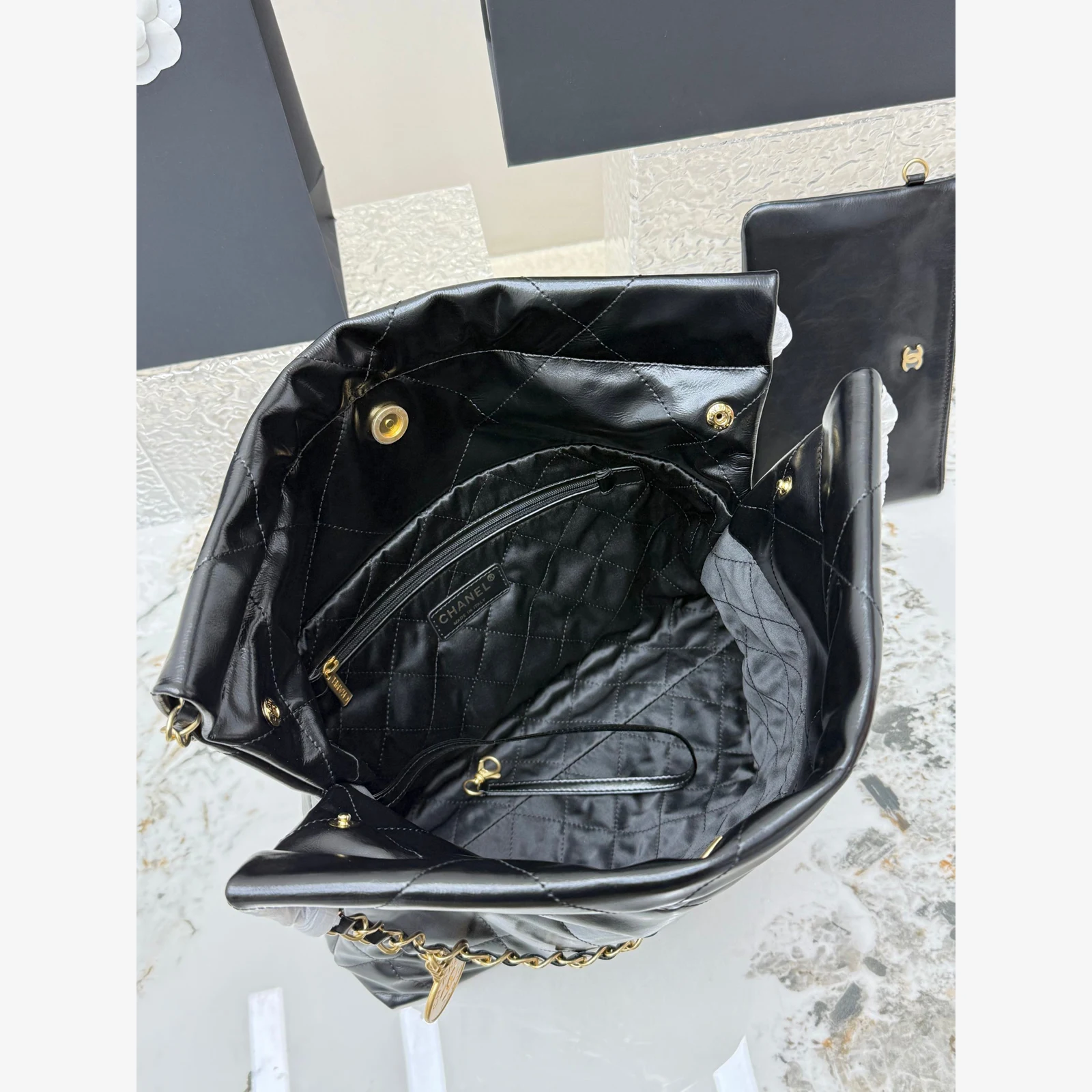 Chanel 22 Small Handbag · Black Shiny Calfskin Black · Shiny Calfskin · Gold-Tone Metal