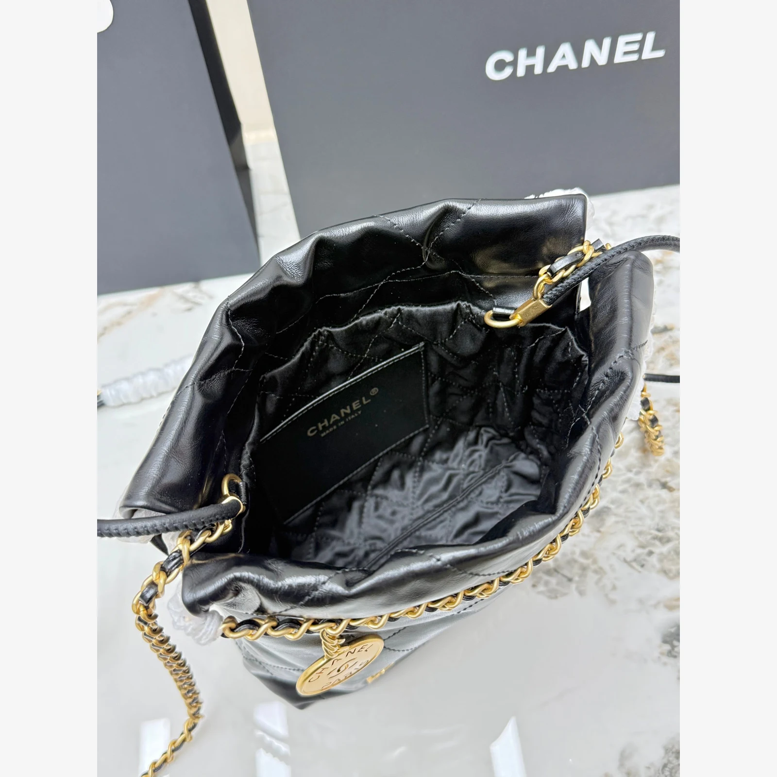 Chanel 22 Mini Handbag · Black Shiny Calfskin Black · Shiny Calfskin · Gold-Tone Metal