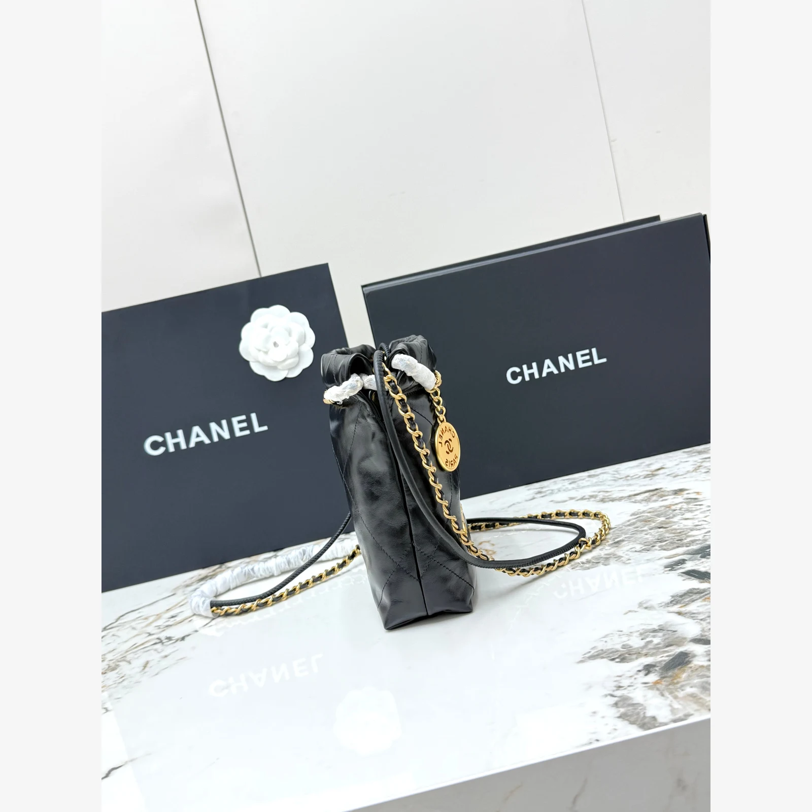 Chanel 22 Mini Handbag · Black Shiny Calfskin Black · Shiny Calfskin · Gold-Tone Metal