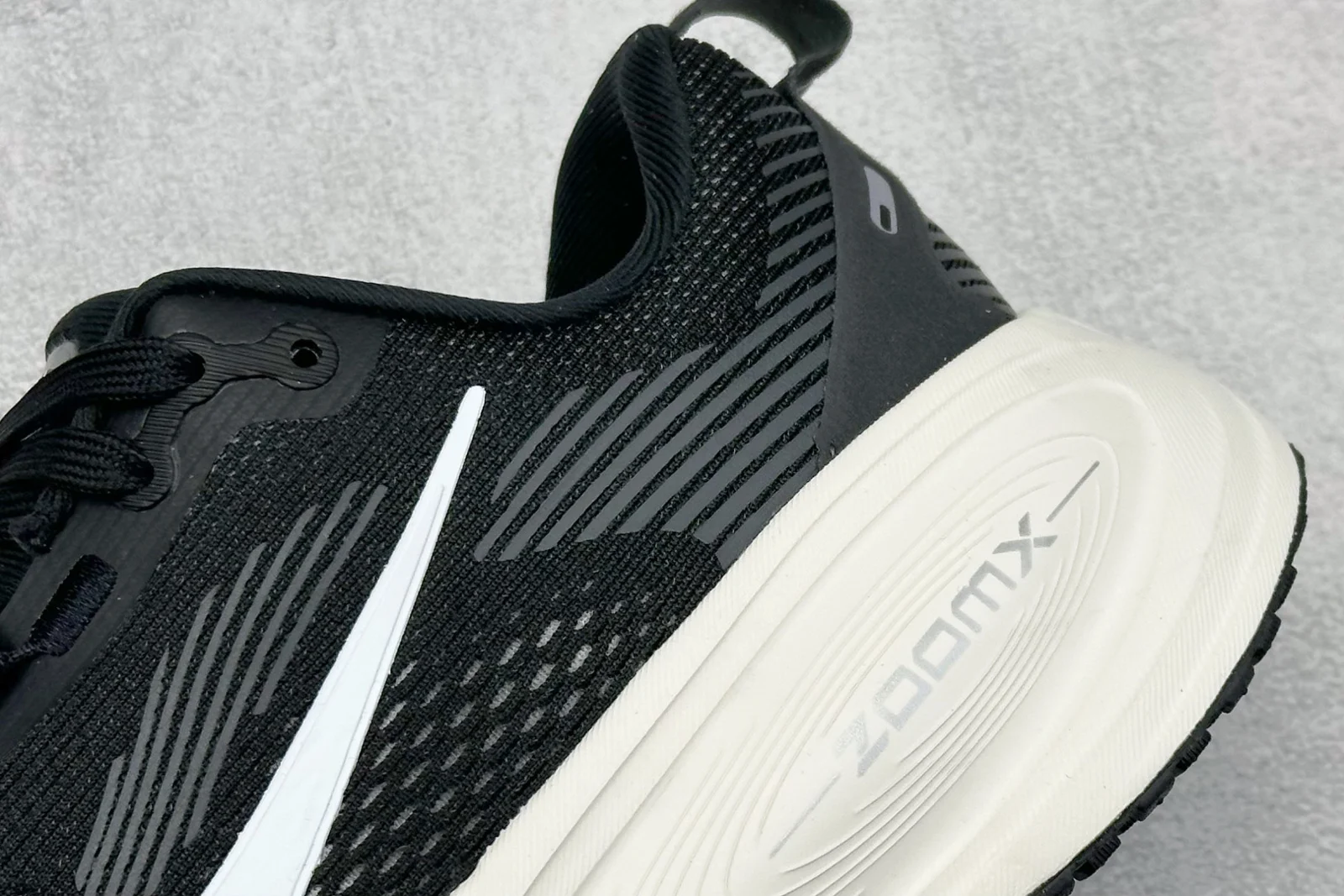 Nike Vomero 18 Men · Black / Coconut Milk / Light Iron Ore / Summit White · HM6803-007