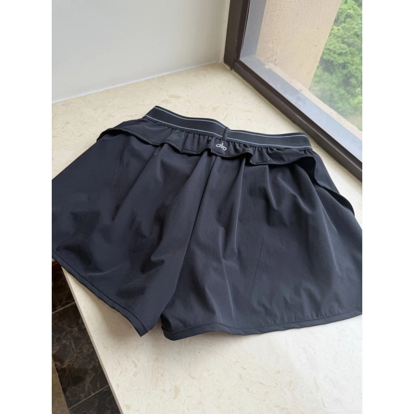 Alo Match Point Short Black · W6334R