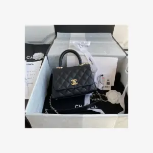 Chanel Mini Flap Bag with Top Handle AS2215 · Black Grained Calfskin — image 1